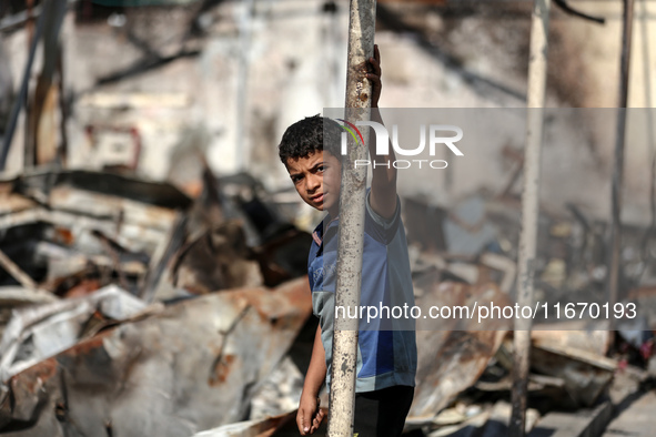 Palestinian displaced people are present at the site of an Israeli airstrike on the tents of the displaced inside the Al-Aqsa Martyrs Hospit...