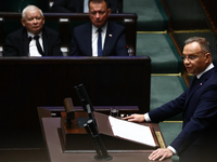 Polish President Andrzej Duda speaks as Law and Justice party leader Jaroslaw Kaczynski and Mariusz Blaszczak listen during the Polish Parli...