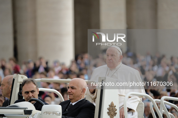 Pope Francis arrives in St. Peter's Square at the Vatican on October 16, 2024, for the weekly general audience. 