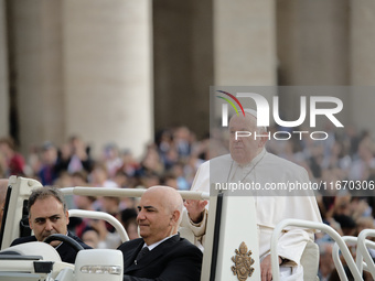 Pope Francis arrives in St. Peter's Square at the Vatican on October 16, 2024, for the weekly general audience. (