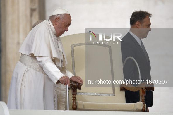 Pope Francis arrives in St. Peter's Square at the Vatican on October 16, 2024, for the weekly general audience. 