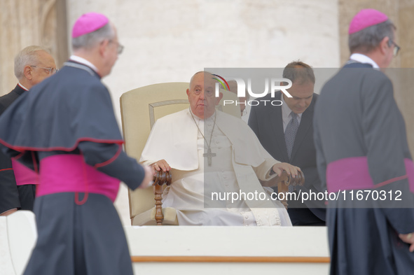 Pope Francis looks on during the weekly general audience at Saint Peter's Square in The Vatican on October 16, 2024. 