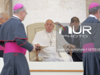 Pope Francis looks on during the weekly general audience at Saint Peter's Square in The Vatican on October 16, 2024. (