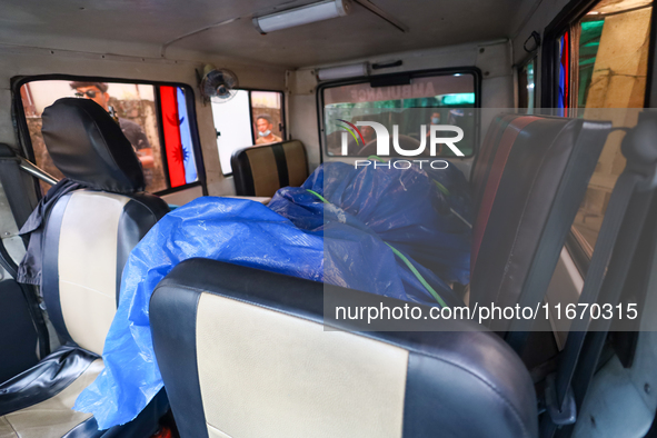 The body of a Russian climber who dies during the summit of Mount Dhaulagiri, the world's 7th highest peak, is seen inside a hearse after it...