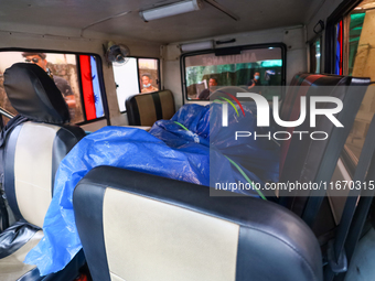 The body of a Russian climber who dies during the summit of Mount Dhaulagiri, the world's 7th highest peak, is seen inside a hearse after it...