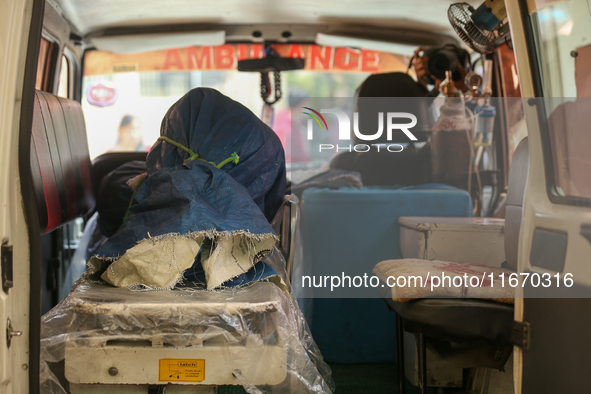 The body of a Russian climber who dies during the summit of Mount Dhaulagiri, the world's 7th highest peak, is seen inside a hearse after it...