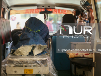 The body of a Russian climber who dies during the summit of Mount Dhaulagiri, the world's 7th highest peak, is seen inside a hearse after it...