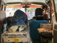 The body of a Russian climber who dies during the summit of Mount Dhaulagiri, the world's 7th highest peak, is seen inside a hearse after it...