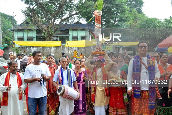 Devotees take part in a religious rally on the occasion of Lakshmi Puja in Beltola, Guwahati, India, on October 16, 2024. Laxmi is one of th...