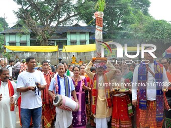 Devotees take part in a religious rally on the occasion of Lakshmi Puja in Beltola, Guwahati, India, on October 16, 2024. Laxmi is one of th...