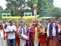 Devotees take part in a religious rally on the occasion of Lakshmi Puja in Beltola, Guwahati, India, on October 16, 2024. Laxmi is one of th...