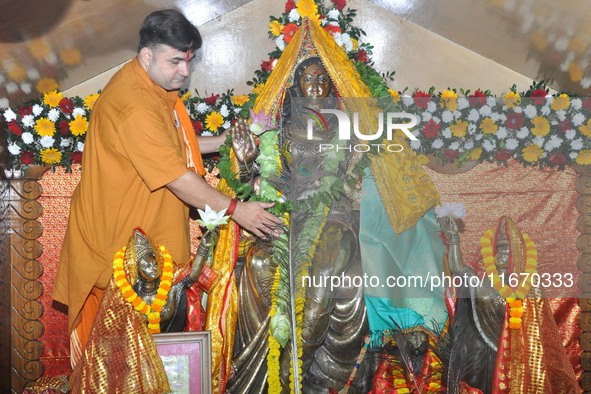 A Hindu priest performs puja on the occasion of Lakshmi Puja in Guwahati, India, on October 16, 2024. Laxmi is one of the most revered and w...