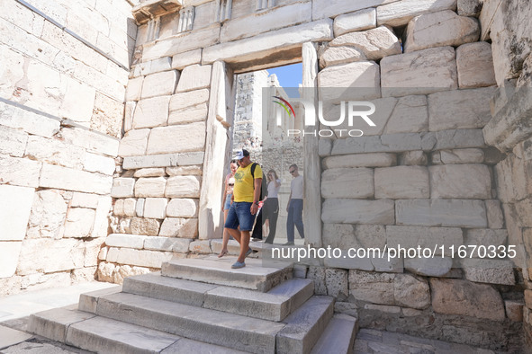 Tourists visit the Acropolis Hill in Athens, Greece, on October 16, 2024. 