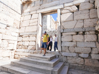 Tourists visit the Acropolis Hill in Athens, Greece, on October 16, 2024. (