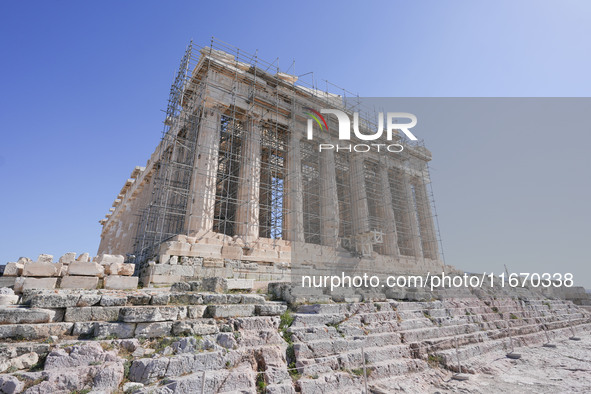 Tourists visit the Acropolis Hill in Athens, Greece, on October 16, 2024. 