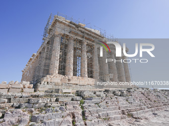 Tourists visit the Acropolis Hill in Athens, Greece, on October 16, 2024. (