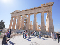 Tourists visit the Acropolis Hill in Athens, Greece, on October 16, 2024. (