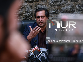 People's Conference President Sajad Gani Lone, along with Imran Reza Ansari, addresses media persons after Omar Abdullah takes the oath as C...