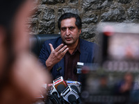 People's Conference President Sajad Gani Lone, along with Imran Reza Ansari, addresses media persons after Omar Abdullah takes the oath as C...