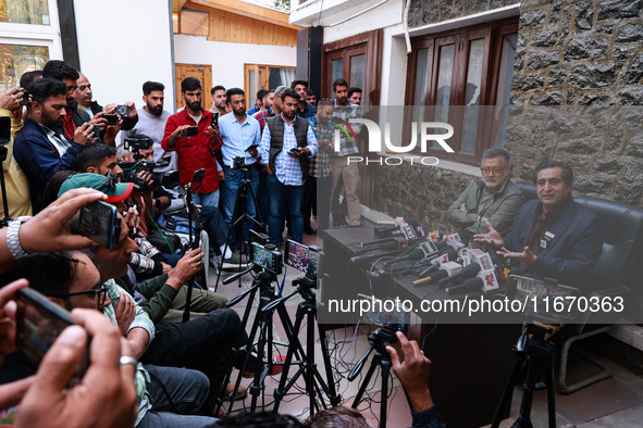 People's Conference President Sajad Gani Lone, along with Imran Reza Ansari, addresses media persons after Omar Abdullah takes the oath as C...