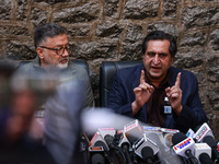 People's Conference President Sajad Gani Lone, along with Imran Reza Ansari, addresses media persons after Omar Abdullah takes the oath as C...