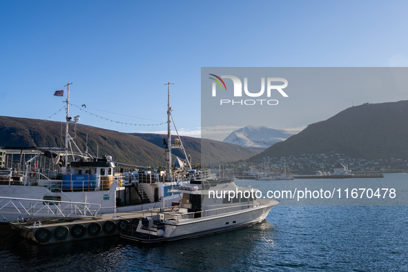 A view of the harbor of Tromso with the Tromsdalstinden mountain in background in Tromso, Norway on September 25, 2024. Tromso is the bigges...