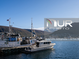 A view of the harbor of Tromso with the Tromsdalstinden mountain in background in Tromso, Norway on September 25, 2024. Tromso is the bigges...