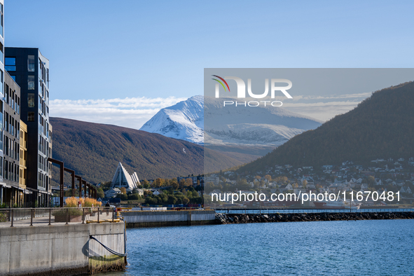 A view of the Tromsdalstinden mountain in background and the Arctic Cathedral on the left, in Tromso, Norway on September 25, 2024. Tromso i...