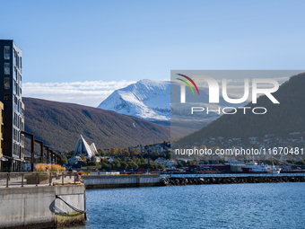 A view of the Tromsdalstinden mountain in background and the Arctic Cathedral on the left, in Tromso, Norway on September 25, 2024. Tromso i...