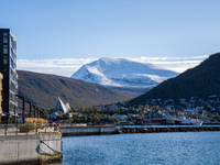 A view of the Tromsdalstinden mountain in background and the Arctic Cathedral on the left, in Tromso, Norway on September 25, 2024. Tromso i...