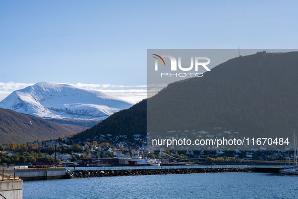 A view of the harbor of Tromso with the Tromsdalstinden mountain in background in Tromso, Norway on September 25, 2024. Tromso is the bigges...