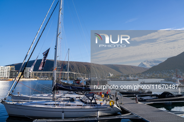 A view of the harbor of Tromso with the Tromsdalstinden mountain in background in Tromso, Norway on September 25, 2024. Tromso is the bigges...