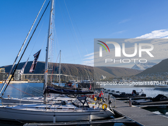 A view of the harbor of Tromso with the Tromsdalstinden mountain in background in Tromso, Norway on September 25, 2024. Tromso is the bigges...