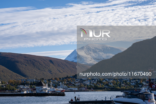 A view of the harbor of Tromso with the Tromsdalstinden mountain in background in Tromso, Norway on September 25, 2024. Tromso is the bigges...