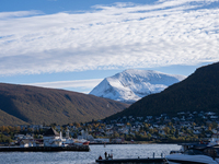 A view of the harbor of Tromso with the Tromsdalstinden mountain in background in Tromso, Norway on September 25, 2024. Tromso is the bigges...