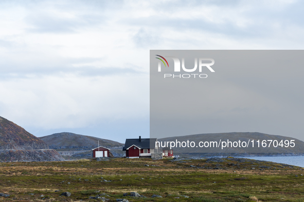 A traditional red Norwegian house sits in the remote landscape of Nordkapp, Norway, on September 27, 2024. Nordkapp, located at the northern...