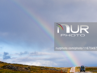 A rainbow stretches across the sky over the E69 road leading to Nordkapp, Norway, on September 27, 2024.  The European route E69 motorway en...