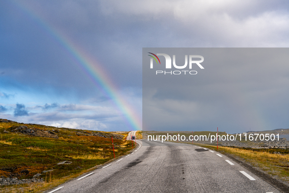 A rainbow stretches across the sky over the E69 road leading to Nordkapp, Norway, on September 27, 2024.  The European route E69 motorway en...