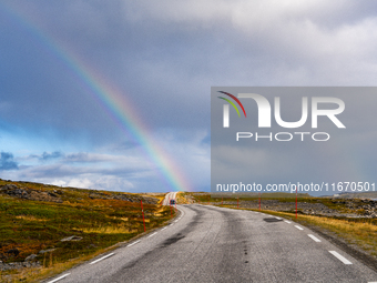 A rainbow stretches across the sky over the E69 road leading to Nordkapp, Norway, on September 27, 2024.  The European route E69 motorway en...