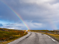 A rainbow stretches across the sky over the E69 road leading to Nordkapp, Norway, on September 27, 2024.  The European route E69 motorway en...