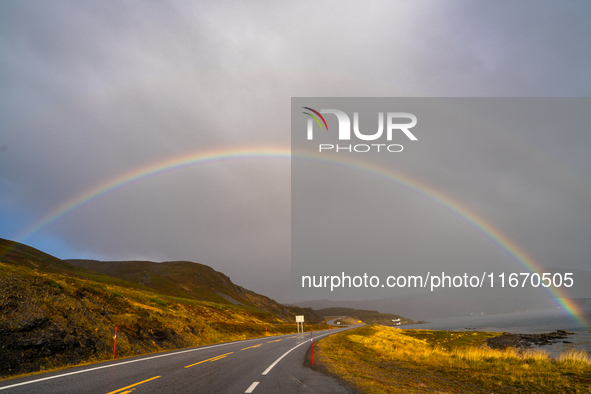 A rainbow stretches across the sky over the E69 road leading to Nordkapp, Norway, on September 27, 2024.  The European route E69 motorway en...