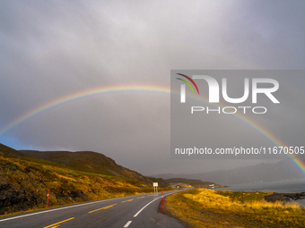 A rainbow stretches across the sky over the E69 road leading to Nordkapp, Norway, on September 27, 2024.  The European route E69 motorway en...