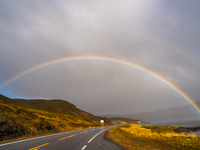 A rainbow stretches across the sky over the E69 road leading to Nordkapp, Norway, on September 27, 2024.  The European route E69 motorway en...