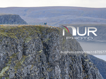 Tourists in North Cape, Norway,  on September 27, 2024. Nordkapp or North Cape is considered the northernmost point in Europe and one of the...