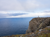 Tourists watches the steel globe in North Cape, Nordkapp, Norway on September 27, 2024. Nordkapp or North Cape is considered the northernmos...