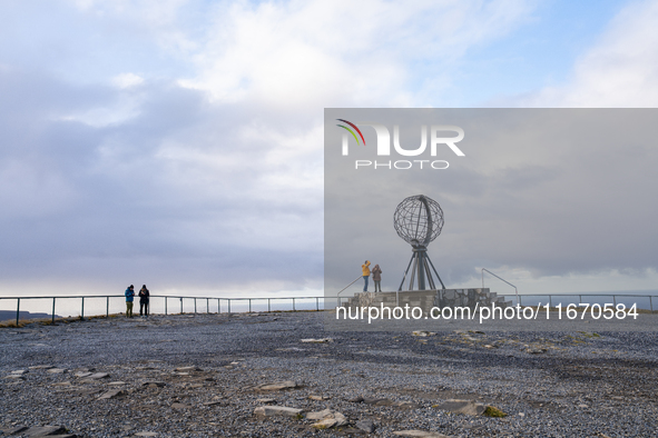 Tourists watches the steel globe in North Cape, Nordkapp, Norway on September 27, 2024. Nordkapp or North Cape is considered the northernmos...