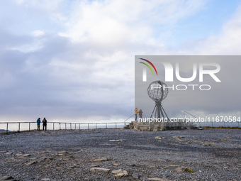 Tourists watches the steel globe in North Cape, Nordkapp, Norway on September 27, 2024. Nordkapp or North Cape is considered the northernmos...