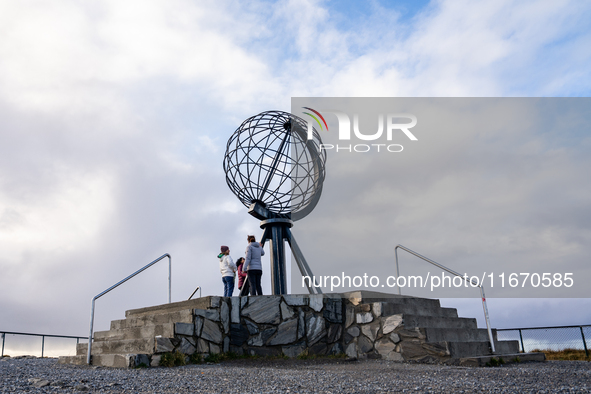 Tourists watches the steel globe in North Cape, Nordkapp, Norway on September 27, 2024. Nordkapp or North Cape is considered the northernmos...