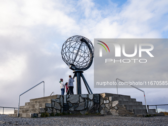 Tourists watches the steel globe in North Cape, Nordkapp, Norway on September 27, 2024. Nordkapp or North Cape is considered the northernmos...