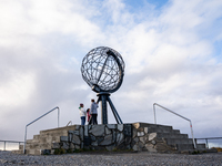 Tourists watches the steel globe in North Cape, Nordkapp, Norway on September 27, 2024. Nordkapp or North Cape is considered the northernmos...